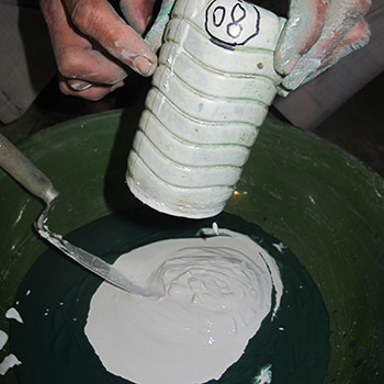 Measuring slaked lime for cement render – Workshop, Ali Bagh, Western India