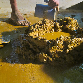 Mixing Ochre and cement together for concrete samples – Ali Bagh, Western India